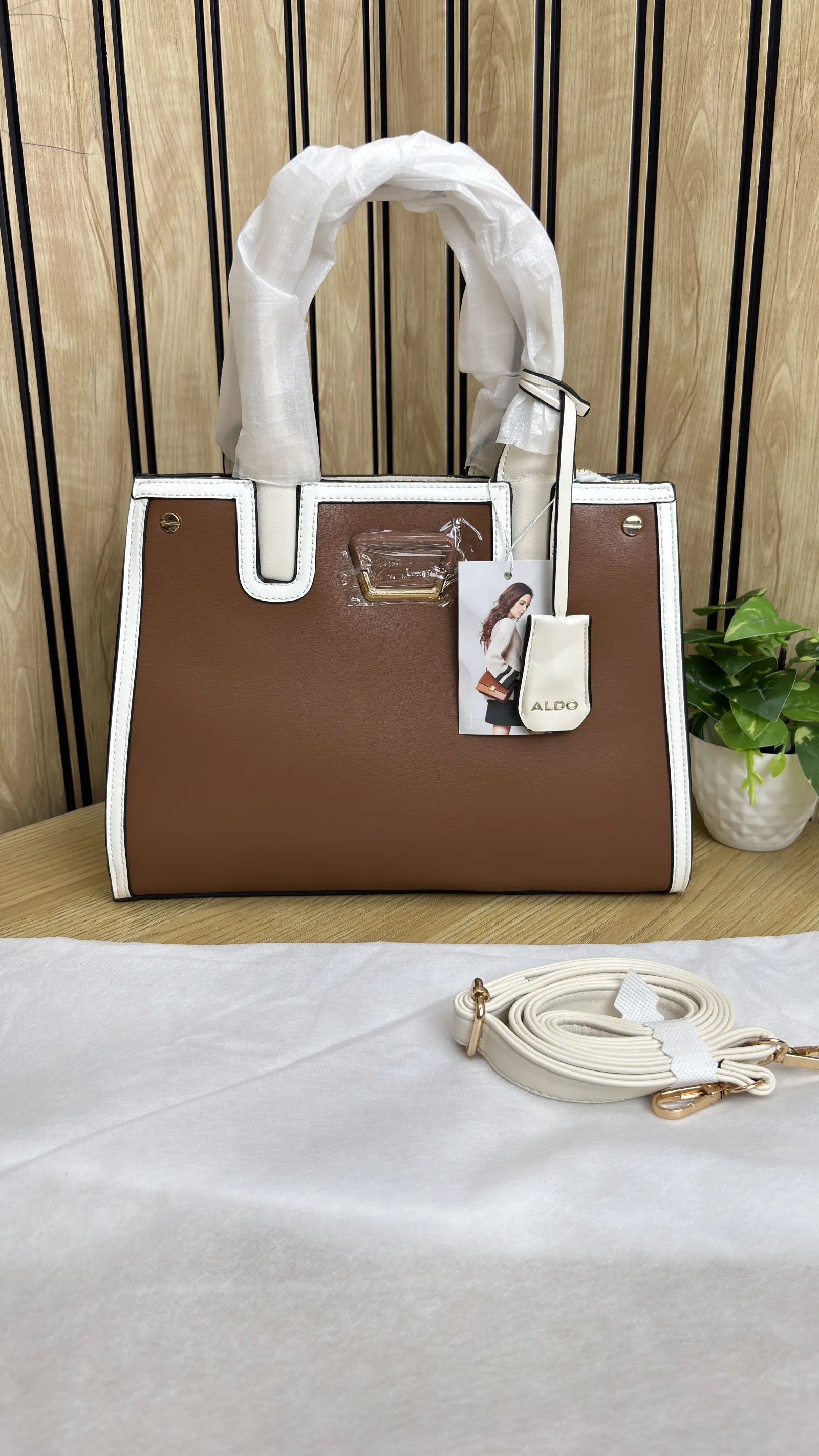 ALDO BUCKET SLING BAG WITH TASSELED